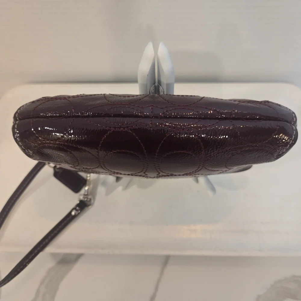 Coach Burgundy Patent Leather Logo Embossed Wristlet Clutch Bag